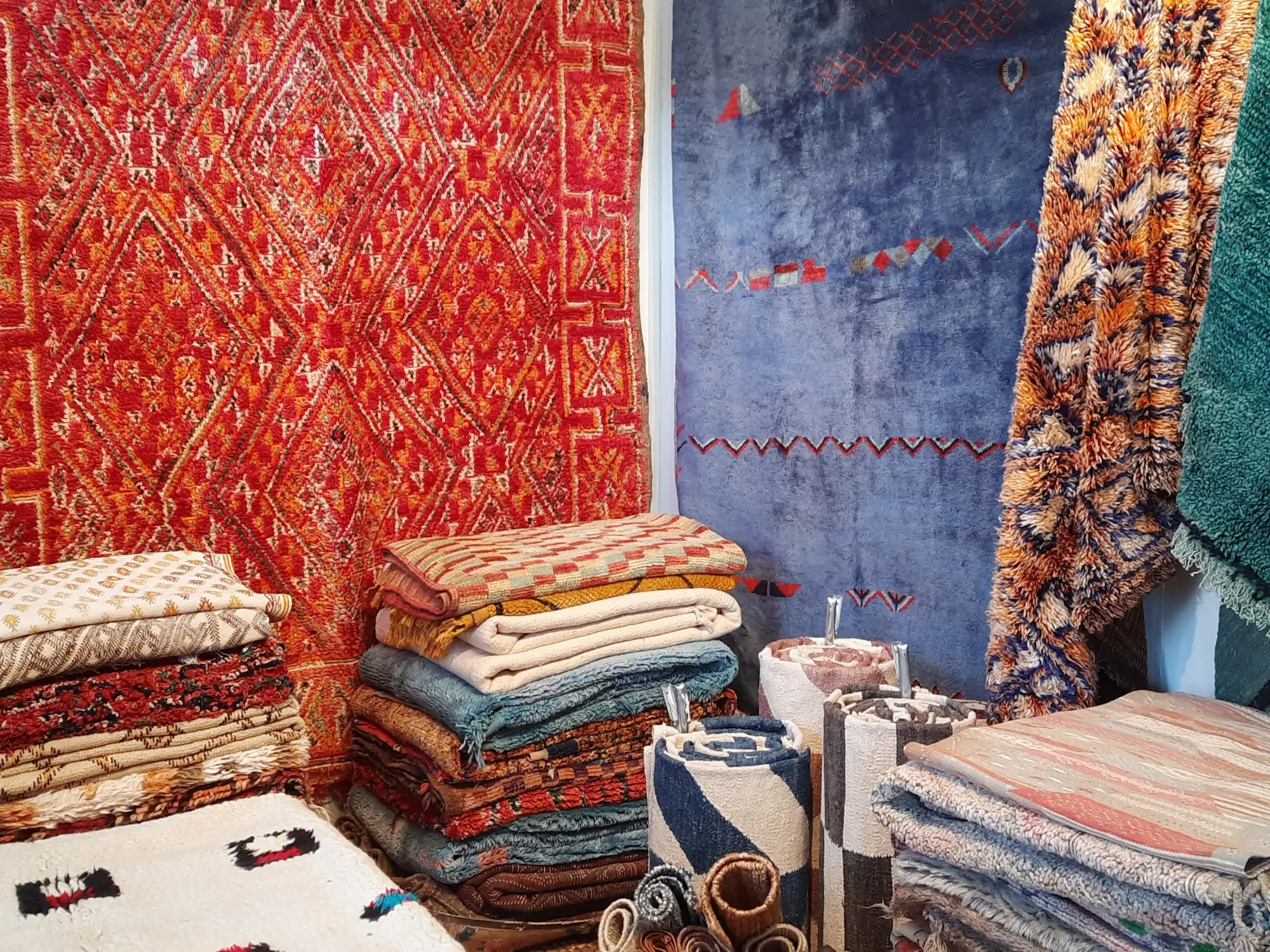 Visitors browsing antique carpets at LARTA